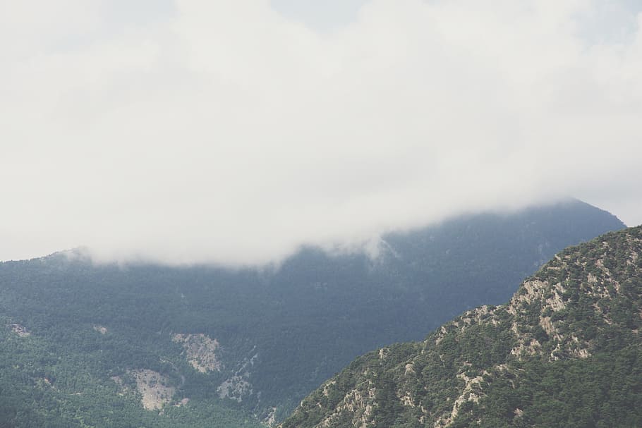 aerial view of mountain covered in clouds, cloud covered mountain HD wallpaper