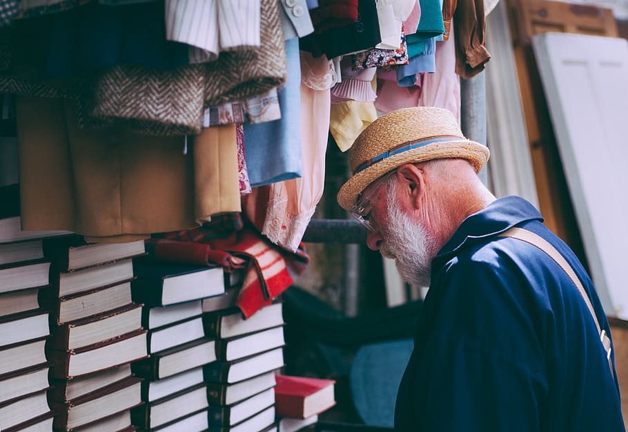 Man in Brown Sun Hat Facing Black Covered Piled Books, clothes HD wallpaper