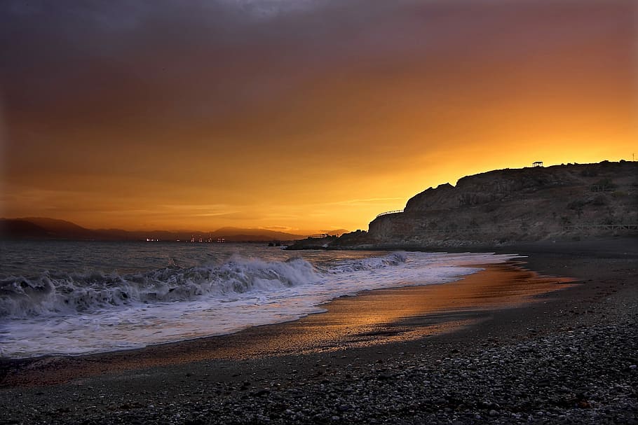 landscape photography of seashore near cliff, landscape photography of beach under cloudy skies during sunset HD wallpaper