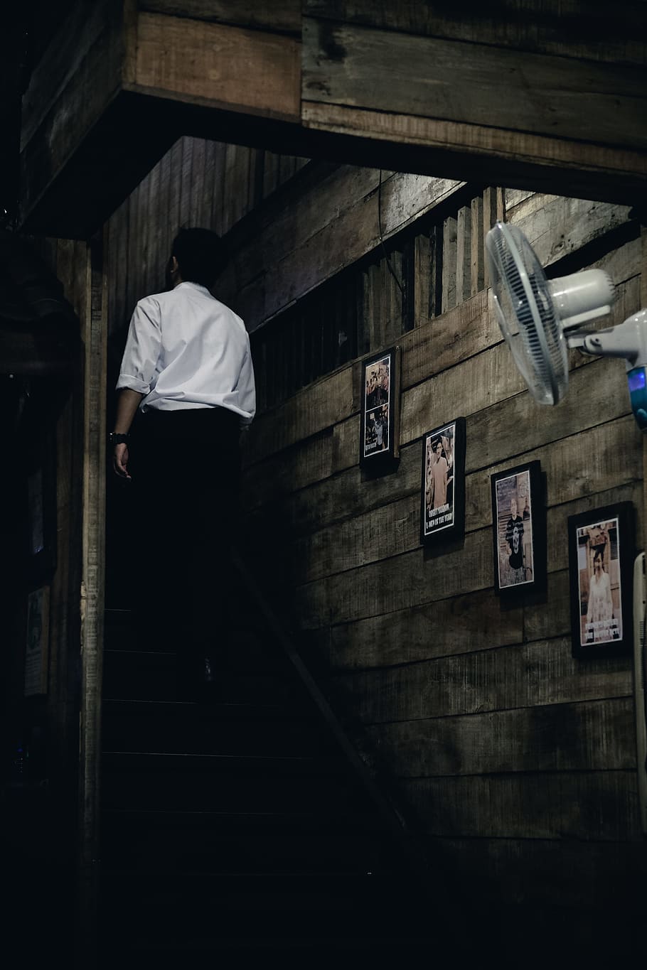 man in white dress shirt and black dress pants walking upstairs inside brown house, man wearing white dress shirt and dress pants HD wallpaper