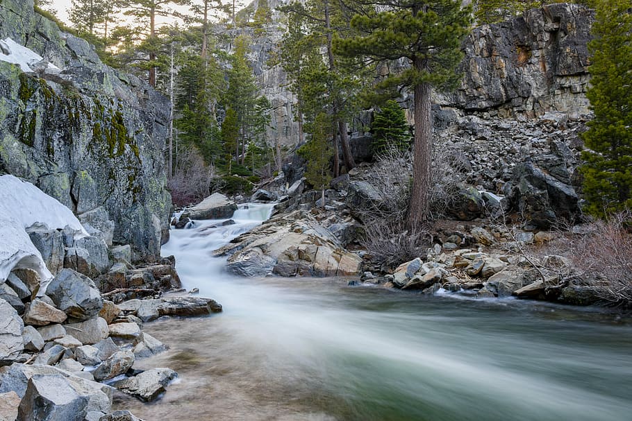 timelapse photography of river flowing between gray rock formations, time lapse photography of body of water HD wallpaper