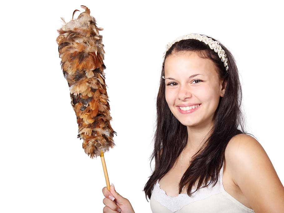 woman in white and beige spaghetti strap shirt holding feather duster HD wallpaper