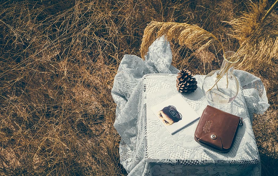 brown leather wallet on table near glass vase, nature, relax HD wallpaper