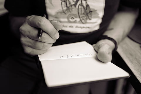 person holding pen and notebook, writing, hand, notes, fingers HD wallpaper
