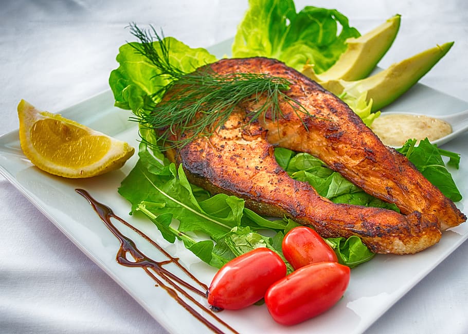 cooked fish on plate with side dish, salmon, grilled fish, gourmet