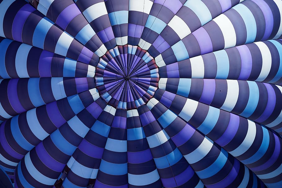 aerial photo of purple and white blimp, blue, black, spiral, ceiling