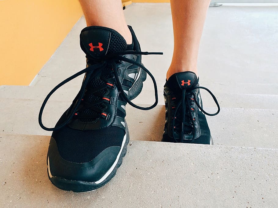 person wearing black Under Armour shoes on stairs, step, climb HD wallpaper