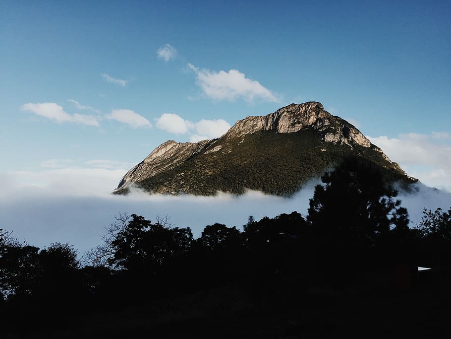 mountain peak over clouds under blue sky during daytime, nature HD wallpaper