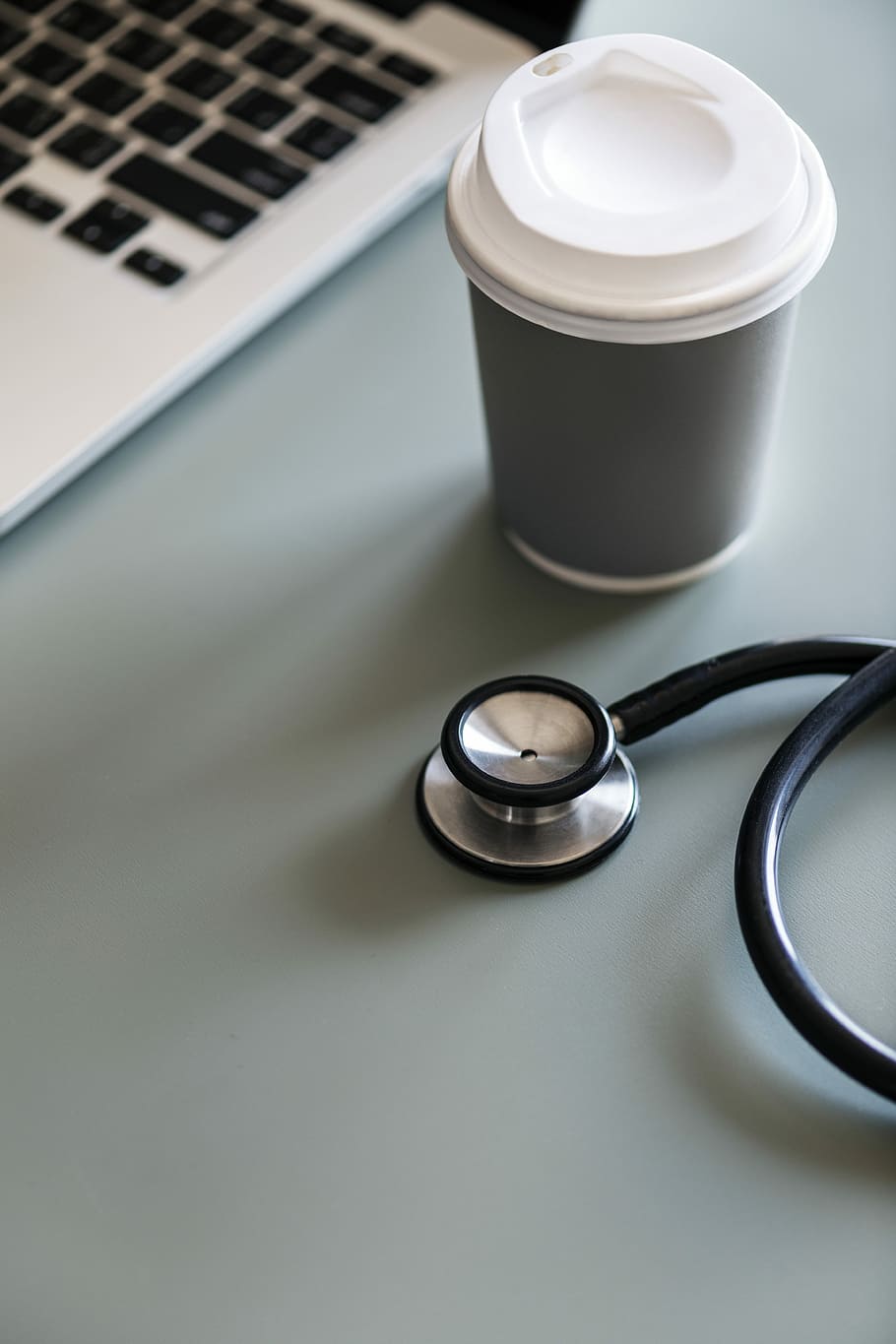 black and gray stethoscope beside white and gray cup, technology HD wallpaper