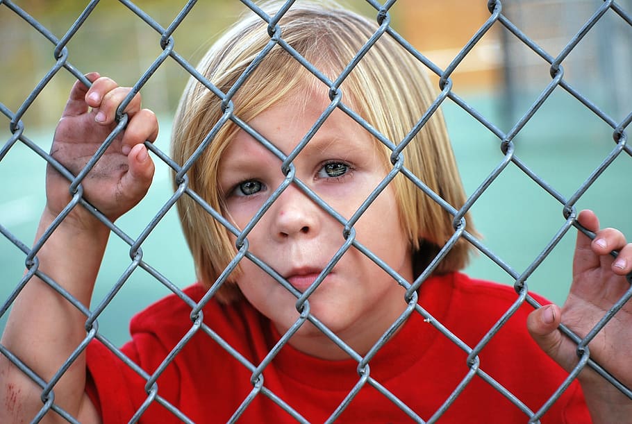 boy' wearing red shirt, looking, fence, chain link, young, child HD wallpaper