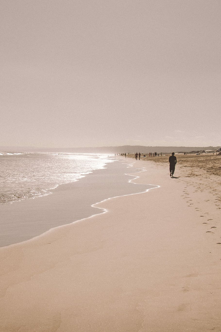 Slowly drifting, man standing at seashore with brown sand, beach HD wallpaper