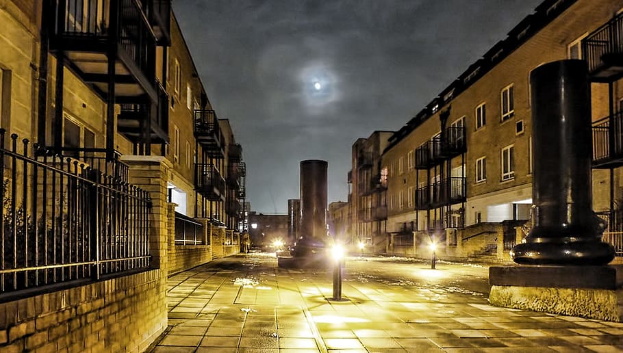 turned-on bollard lamp between concrete buildings, Night, Sky HD wallpaper