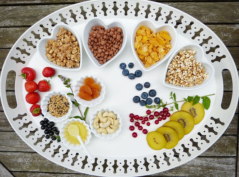 white ceramic plates with nuts, tray, breakfast, muesli, fruit