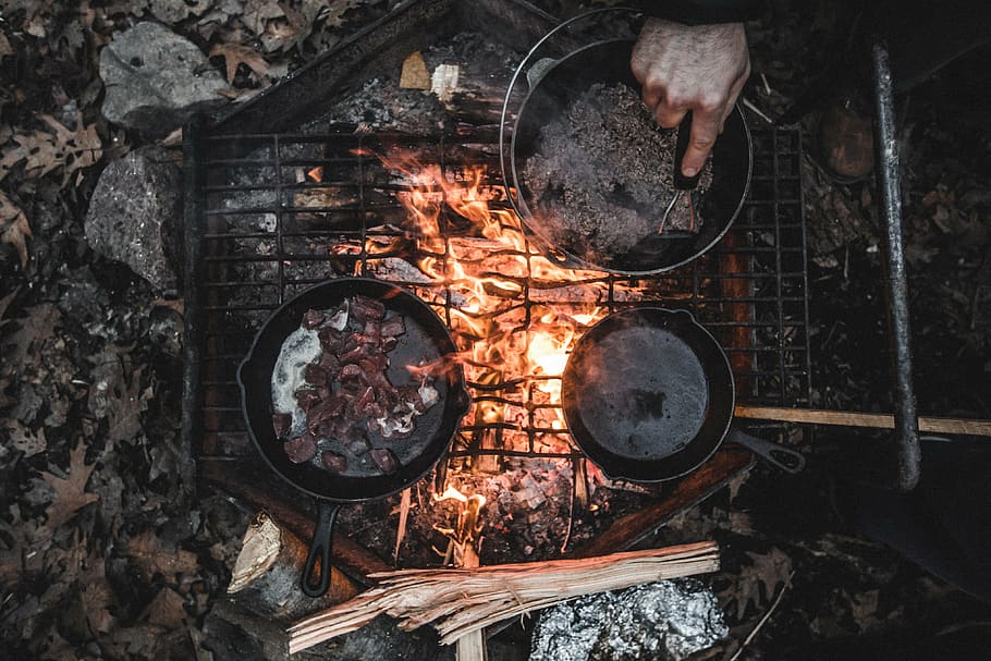 man cooking on grill using cooking pad and skillet at daytime, HD wallpaper
