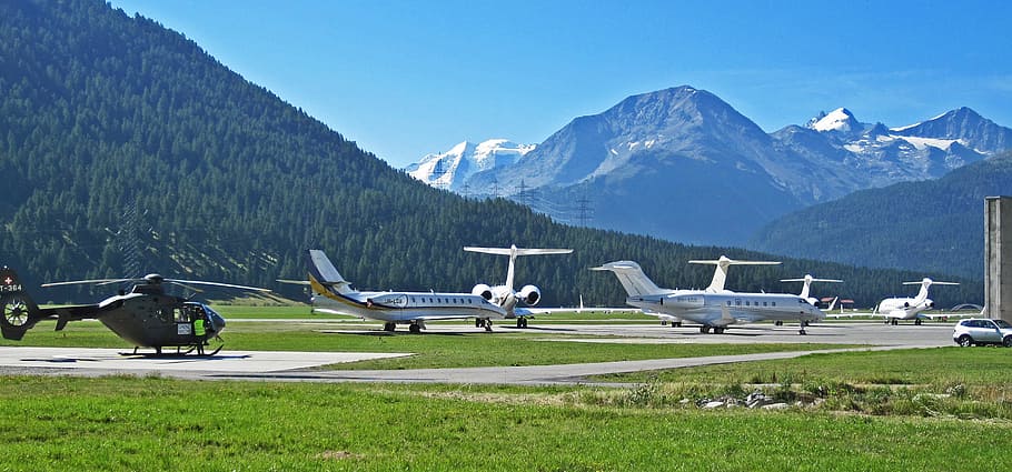 plane parked on field, airport, st moritz, samedan, engadin, graubünden