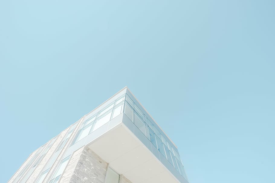 low-angle photography of white curtain glass-walled building HD wallpaper