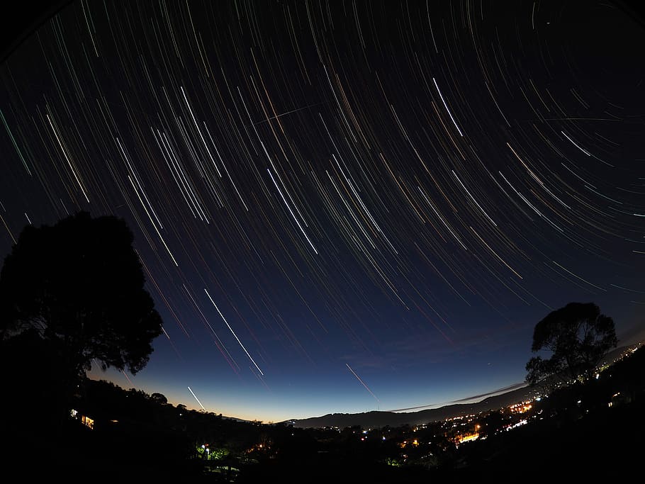 time-lapse photography of trees and city during night, sky HD wallpaper
