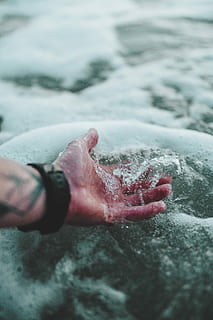 time lapse photography of person holding water, person's hand touching body of water HD wallpaper