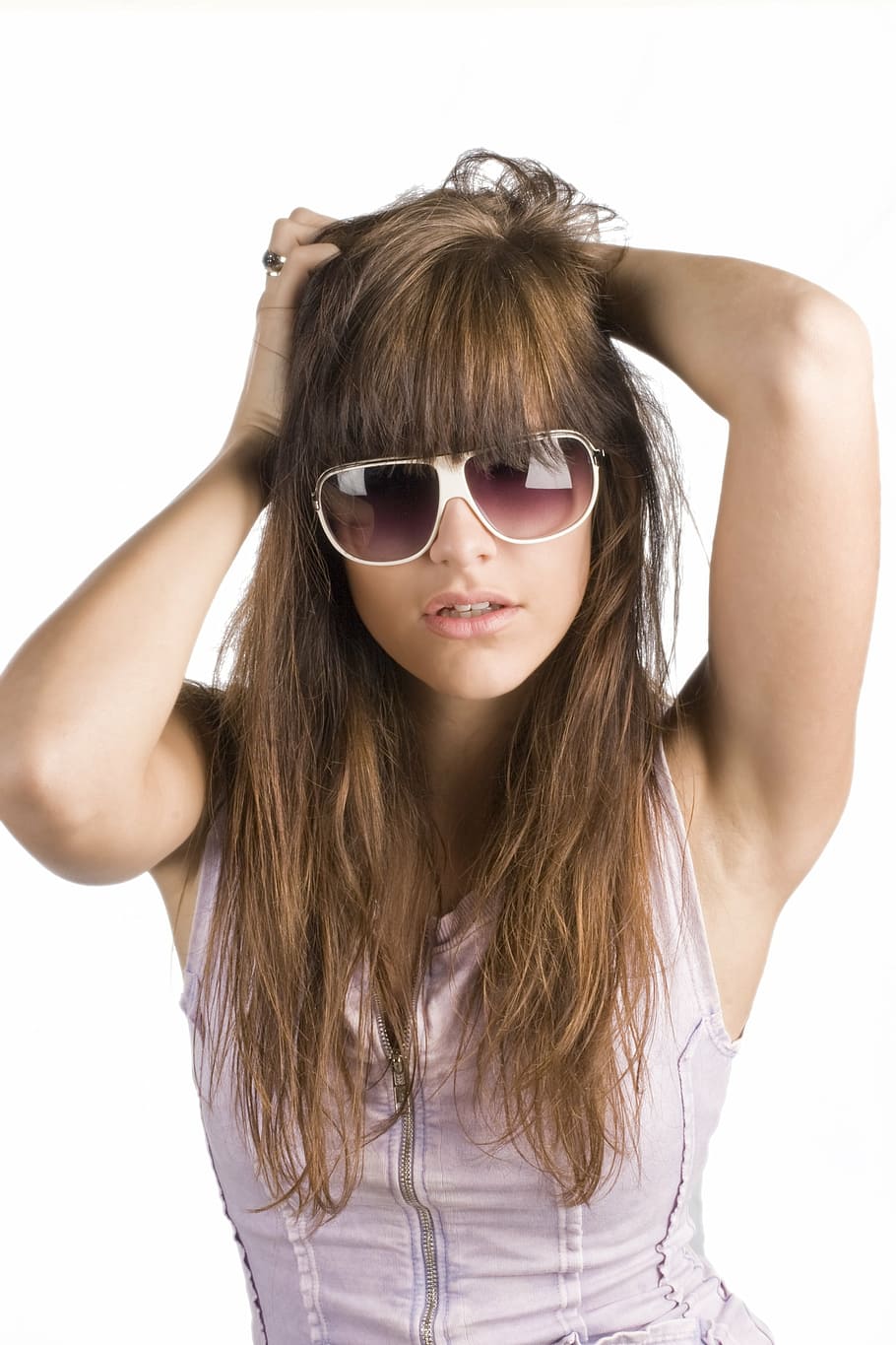 woman in pink tank top wearing white frame sunglasses, model