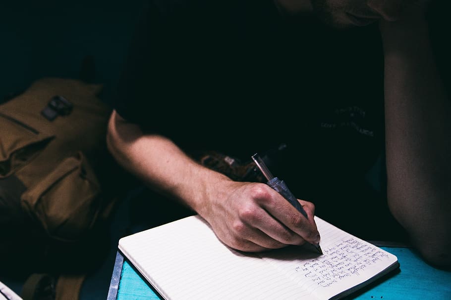 people, man, writing, notebook, pen, study, light, dark, one person HD wallpaper