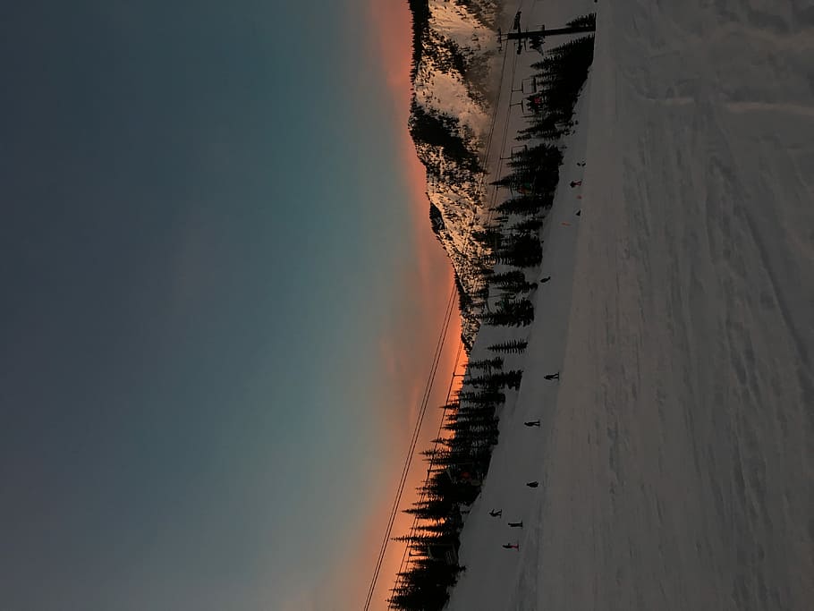 Mountain Sunsets, trees in snowfield at daytime, mountain range HD wallpaper