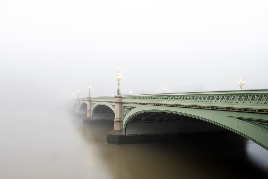 foggy bridge photo, arch-shaped green concrete bridge under white clouds HD wallpaper