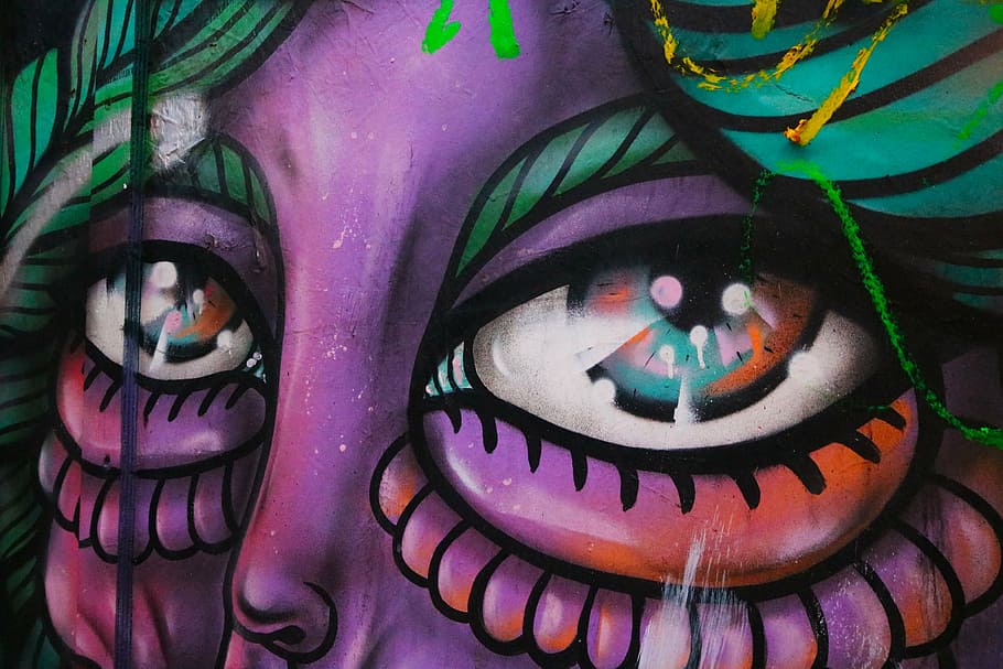 photo of purple and green woman portrait mural, graffiti, eyes