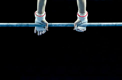 person wearing white gloves holding on gray metal bar, active HD wallpaper