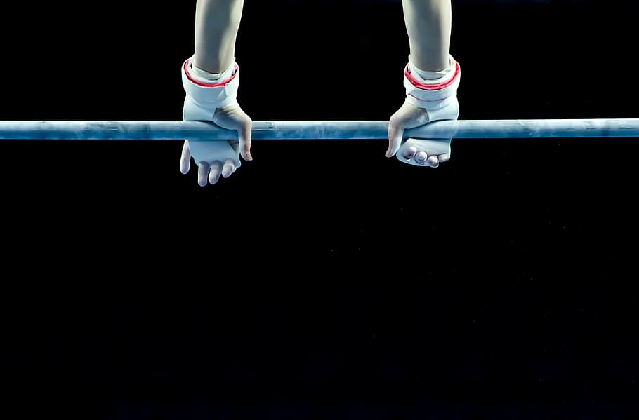person wearing white gloves holding on gray metal bar, active HD wallpaper