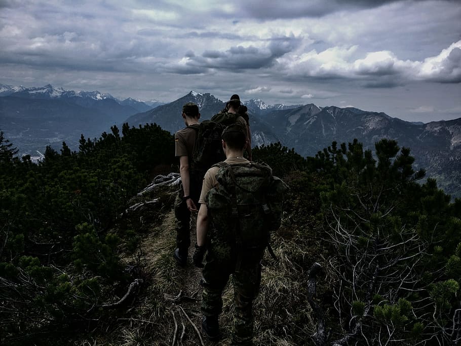 men walking on top of mountain, people walking on top of mountain under cloudy sky HD wallpaper
