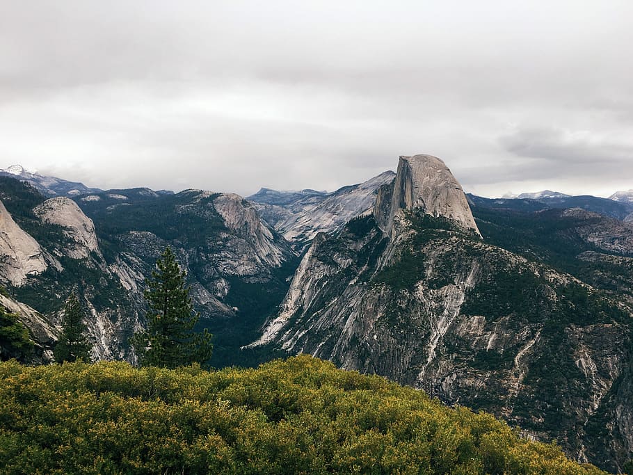 mountain ranges under cloudy sky during daytime, landscape photography of mountain ranges under cloudy sky during daytime HD wallpaper