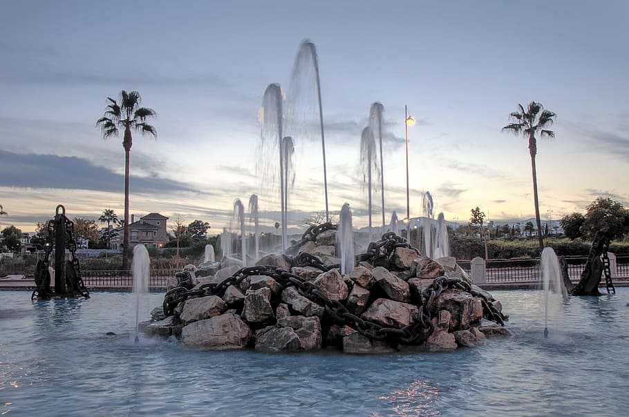 palms, chains, source, evening, water, stones, art, sky, nature HD wallpaper
