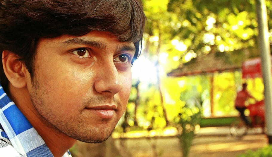 close-up photography of a man's face, indian, park, close up