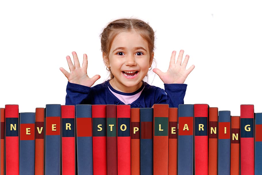 girl standing in front of row books, learn, school, nursery school