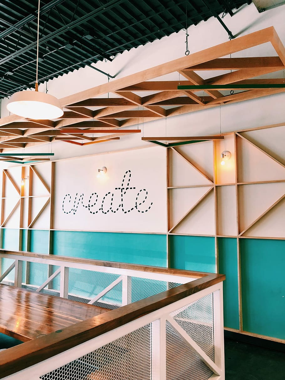 brown wooden wall with create decal, white and teal painted walls
