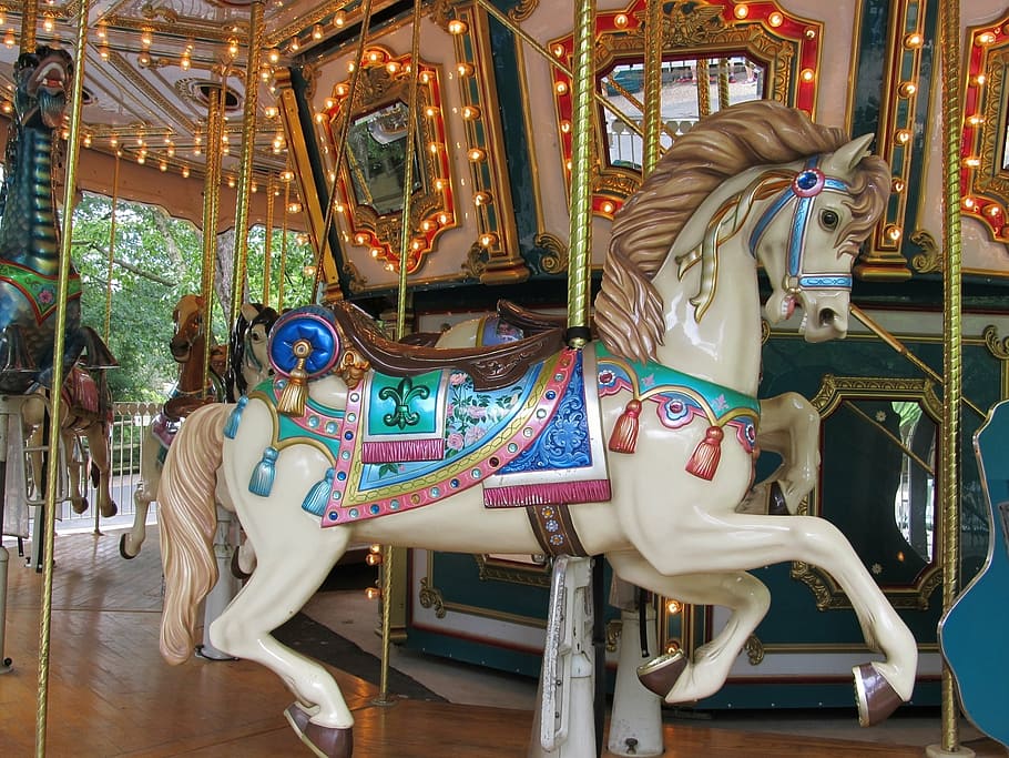 white, blue, and brown horse carousel, wooden horse, merry go round