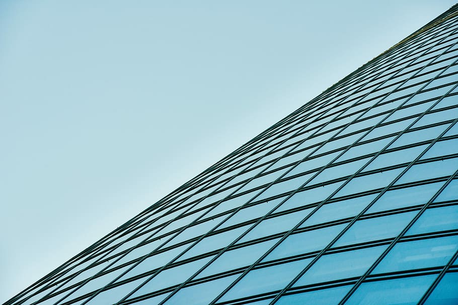 low angle photography of glass building, clear glass curtain wall building under blue sky HD wallpaper