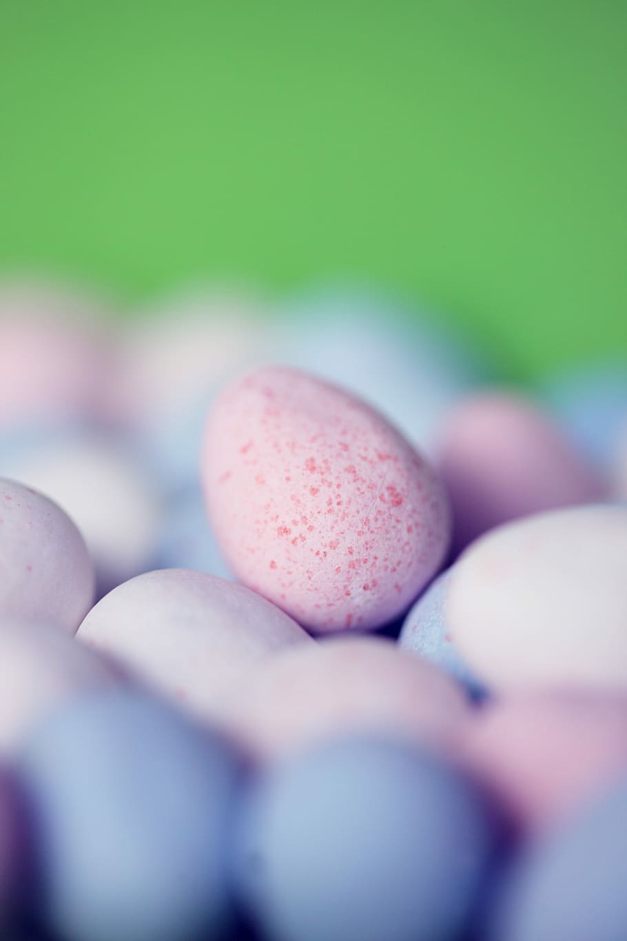 beige pebble shot, focus photography of pink egg, eggs, mini egg HD wallpaper