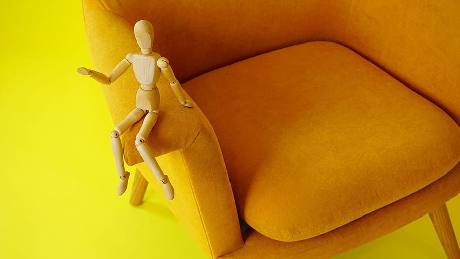 beige wooden string puppet on chair, brown wood puppet on armrest, HD wallpaper