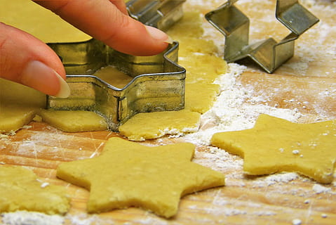 person holding gray star cookie cutter, dough, cut out, bake HD wallpaper