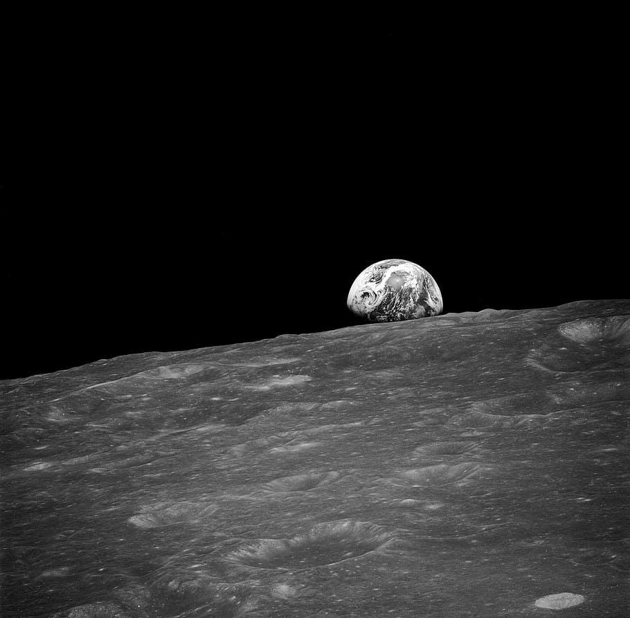 gray scale photo of earth as viewed from the moon's surface, soil creep