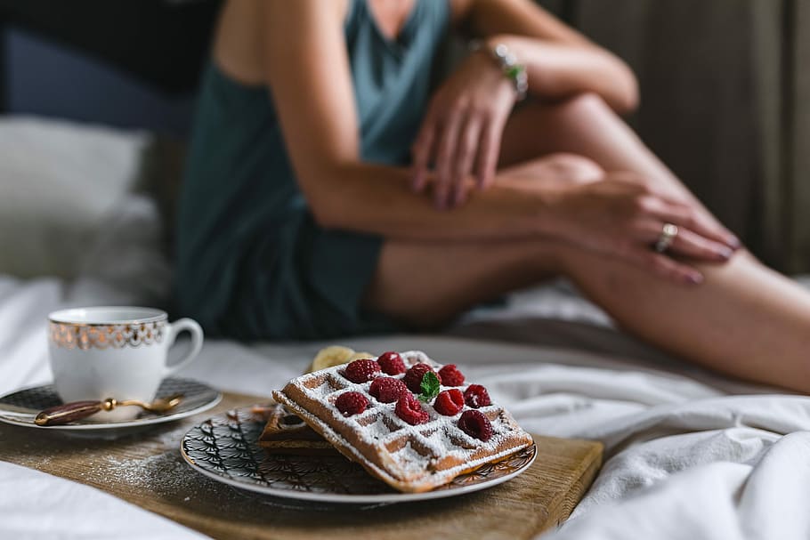Breakfast in bed - waffles with raspberries and cup of coffee on the tray HD wallpaper