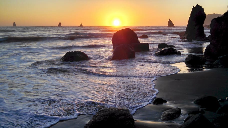 body of water beside rocks during golden hour photography, sunset HD wallpaper