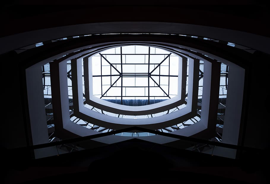 low-angle photography of white building interior with clear glass roof during daytime, photograph of structural interior HD wallpaper