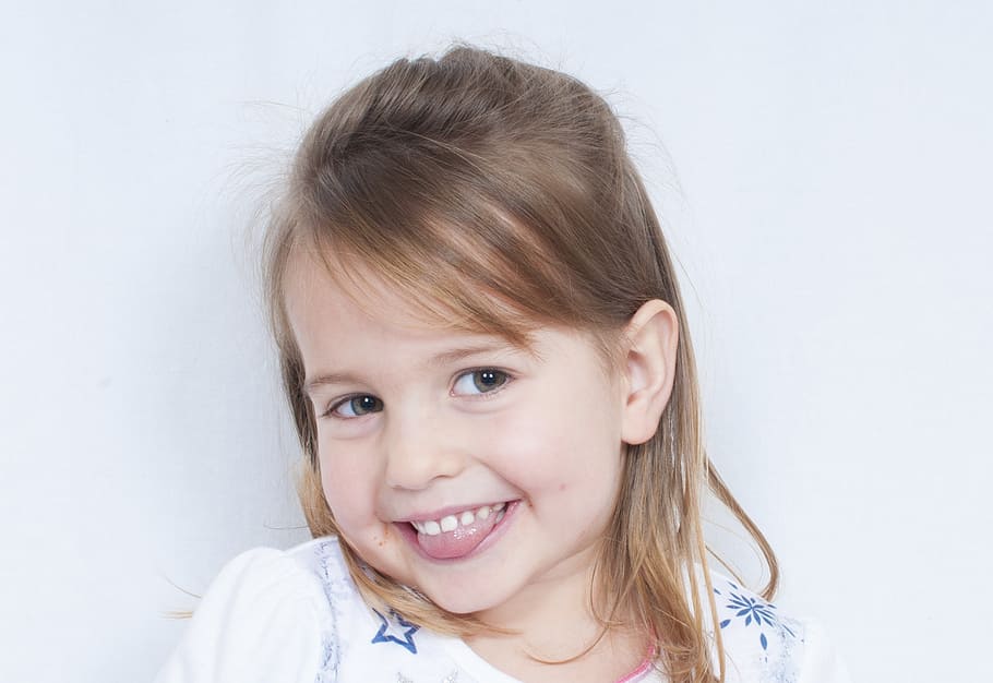 girl wearing white top smiling, child, portrait, happy, fun, kid