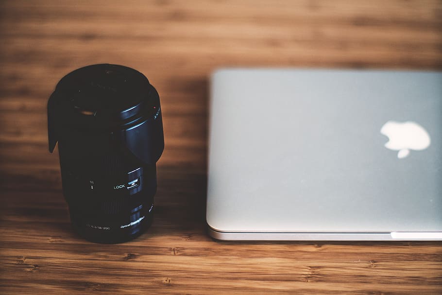Camera lens and laptop computer, technology, table, wood - Material HD wallpaper
