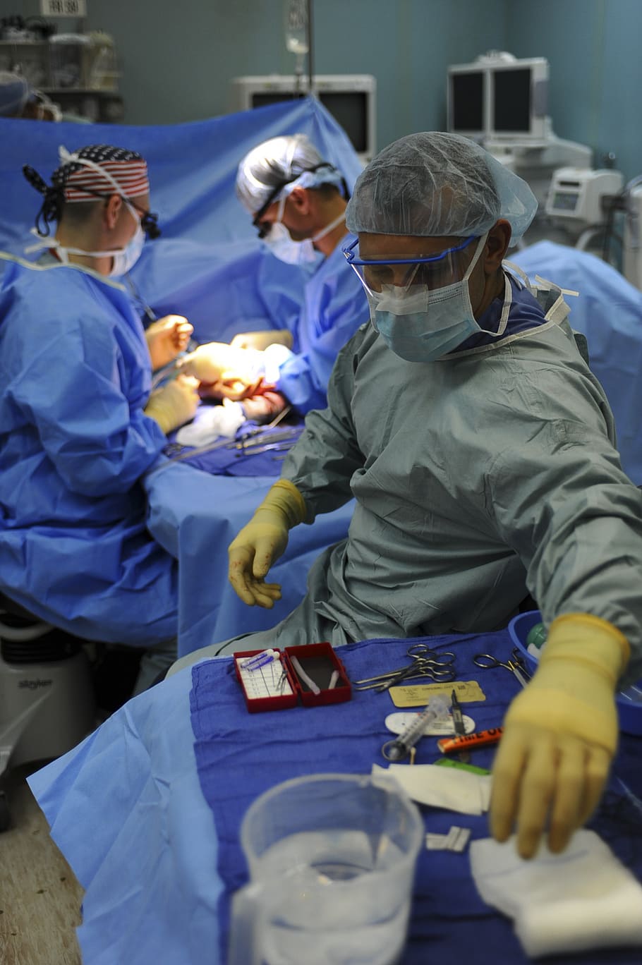 three doctors during medical operation, physician, surgery, nurse