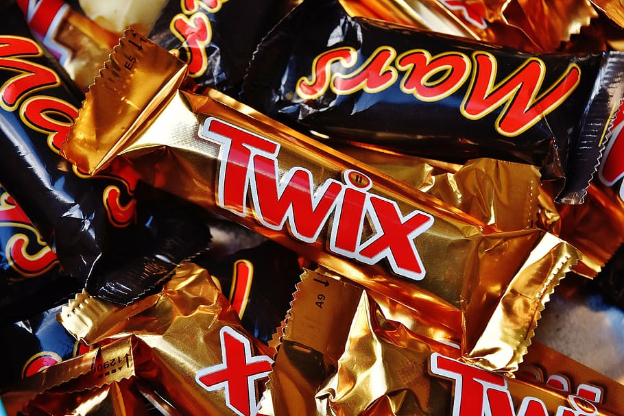 close-up photo of Twix chocolate pack lot, candy bar, sweetness