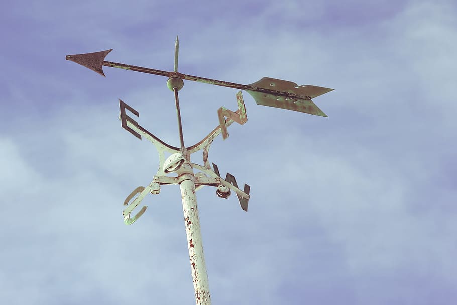 windmill pointing east, low angle photography of white wind vane under blue sky and white clouds HD wallpaper