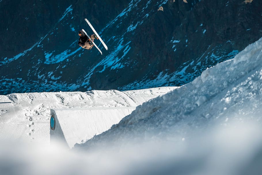 biplane flying near mountain, person skiing during daytime, sport HD wallpaper